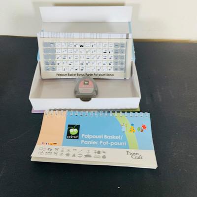 LOT 215: Cricut Expression Machine for Cutting Vinyl Includes Rolls of Vinyl and Expansion Package and More. Cord is Missing