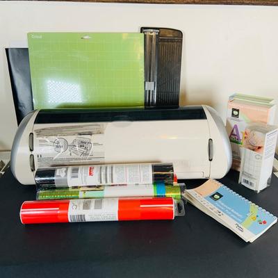 LOT 215: Cricut Expression Machine for Cutting Vinyl Includes Rolls of Vinyl and Expansion Package and More. Cord is Missing