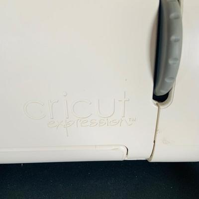 LOT 215: Cricut Expression Machine for Cutting Vinyl Includes Rolls of Vinyl and Expansion Package and More. Cord is Missing