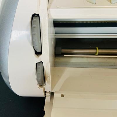 LOT 215: Cricut Expression Machine for Cutting Vinyl Includes Rolls of Vinyl and Expansion Package and More. Cord is Missing