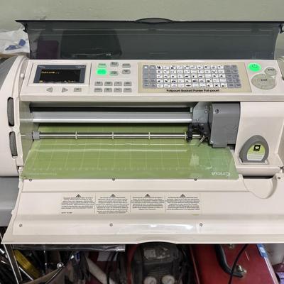 LOT 215: Cricut Expression Machine for Cutting Vinyl Includes Rolls of Vinyl and Expansion Package and More. Cord is Missing