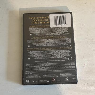 LOT 219: Books & More: Unopened Lord of the Rings Collection, The Spiderwick Chronicles Books, The Dark Rising Sequence