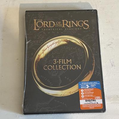LOT 219: Books & More: Unopened Lord of the Rings Collection, The Spiderwick Chronicles Books, The Dark Rising Sequence