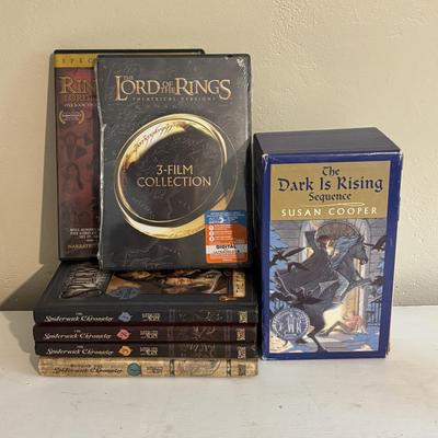 LOT 219: Books & More: Unopened Lord of the Rings Collection, The Spiderwick Chronicles Books, The Dark Rising Sequence