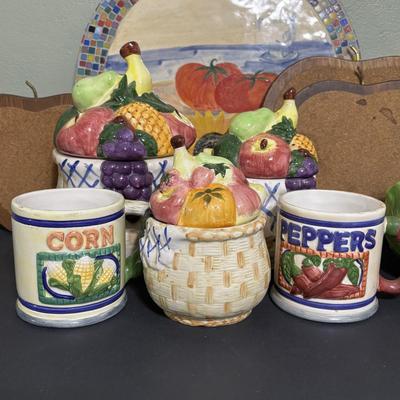 LOT 220: Fruit & Veggie Kitchen Collection: Home Interiors Vegetable Plaques, Apple Hot Plates Fruit Canisters, Holland Mold Ceramic...