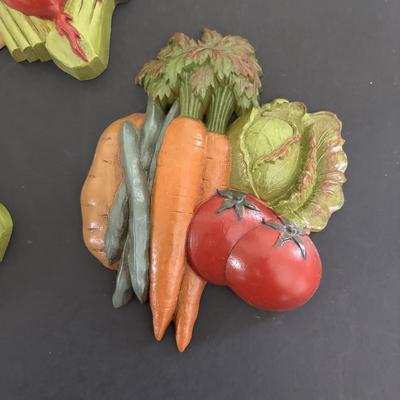 LOT 220: Fruit & Veggie Kitchen Collection: Home Interiors Vegetable Plaques, Apple Hot Plates Fruit Canisters, Holland Mold Ceramic...