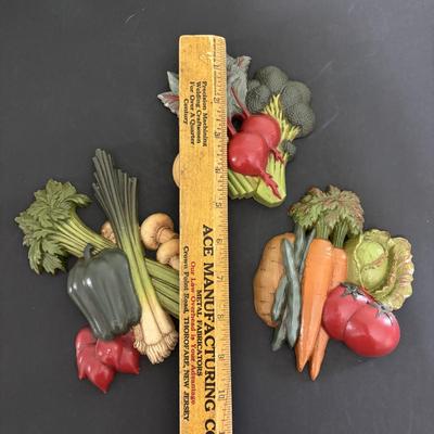 LOT 220: Fruit & Veggie Kitchen Collection: Home Interiors Vegetable Plaques, Apple Hot Plates Fruit Canisters, Holland Mold Ceramic...