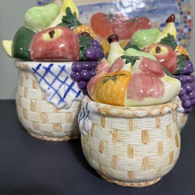LOT 220: Fruit & Veggie Kitchen Collection: Home Interiors Vegetable Plaques, Apple Hot Plates Fruit Canisters, Holland Mold Ceramic...