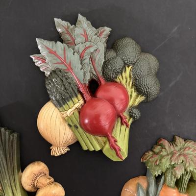 LOT 220: Fruit & Veggie Kitchen Collection: Home Interiors Vegetable Plaques, Apple Hot Plates Fruit Canisters, Holland Mold Ceramic...