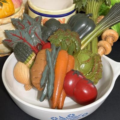 LOT 220: Fruit & Veggie Kitchen Collection: Home Interiors Vegetable Plaques, Apple Hot Plates Fruit Canisters, Holland Mold Ceramic...