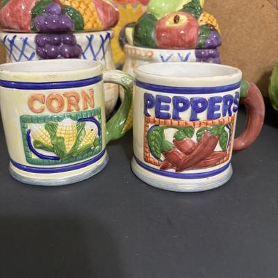 LOT 220: Fruit & Veggie Kitchen Collection: Home Interiors Vegetable Plaques, Apple Hot Plates Fruit Canisters, Holland Mold Ceramic...