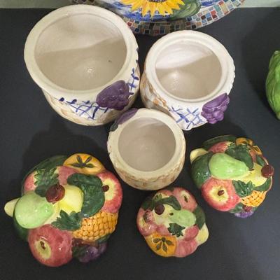 LOT 220: Fruit & Veggie Kitchen Collection: Home Interiors Vegetable Plaques, Apple Hot Plates Fruit Canisters, Holland Mold Ceramic...