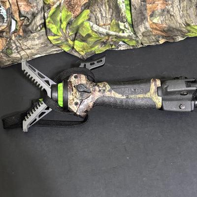 LOT 222: Mossy Oak (XL) Camo Shirt, Outers Shotgun Cleaning Kit, Marksman 4x32 Scope & Primos Trigger Stick Gen2 Jim Shockey Edition