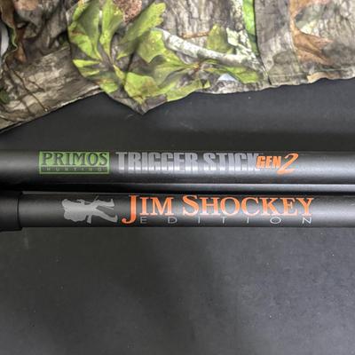 LOT 222: Mossy Oak (XL) Camo Shirt, Outers Shotgun Cleaning Kit, Marksman 4x32 Scope & Primos Trigger Stick Gen2 Jim Shockey Edition