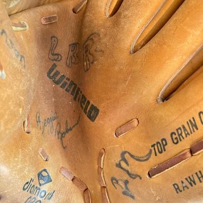 LOT 246: Pair of Softball / Baseball Leather Gloves (Winfield Diamond Pro and Rawlings) with Three Softballs