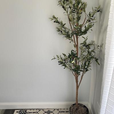 Faux olive tree with rug