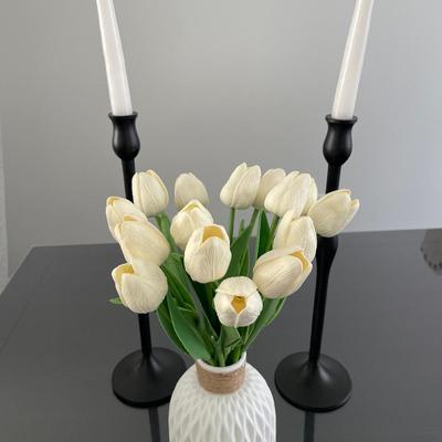 Black candlesticks with small floral decor