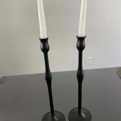 Black candlesticks with small floral decor