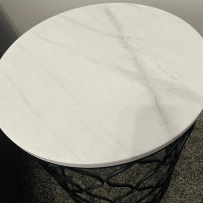 Round marble top and metal base table with b/w decor