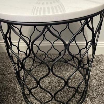 Round marble top and metal base table with b/w decor