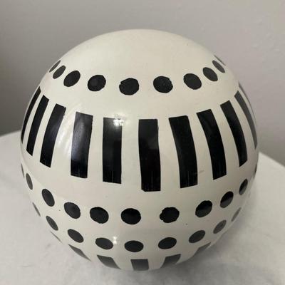 Round marble top and metal base table with b/w decor