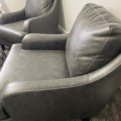 2 grey faux leather accent chairs