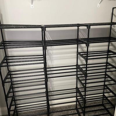 Closet storage rack with collapsible laundry