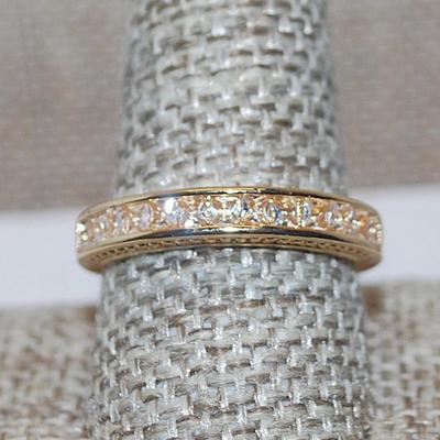 Size 10 Half Infinity Style Ring with Single Row of 13 Clear Stones on a Gold Tone Band (3.9g)