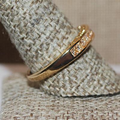 Size 10 Half Infinity Style Ring with Single Row of 13 Clear Stones on a Gold Tone Band (3.9g)