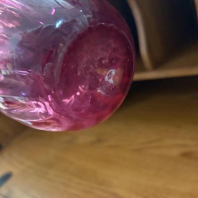 Sale Photo Thumbnail #77: AI assisted information on this item:

This is a vintage cranberry glass jug, likely produced by Pilgrim Glass in the mid-20th century. 

Key features and information include: 
Material and Technique:
It is made of hand-blown cranberry glass, known for it