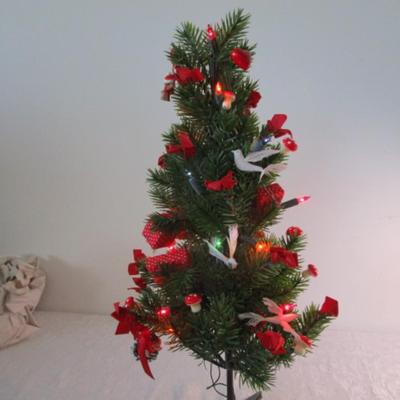Lighted table-top Christmas tree, decorated