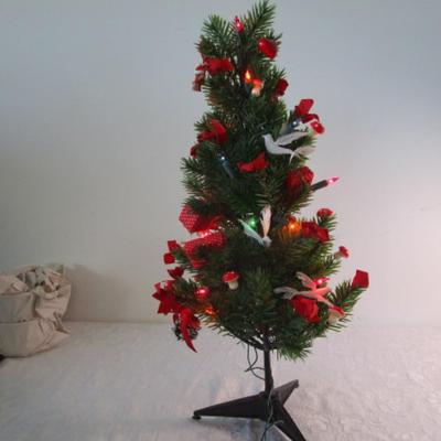 Lighted table-top Christmas tree, decorated