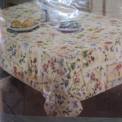 New in pkg 60" x 102" floral fabric tablecloth