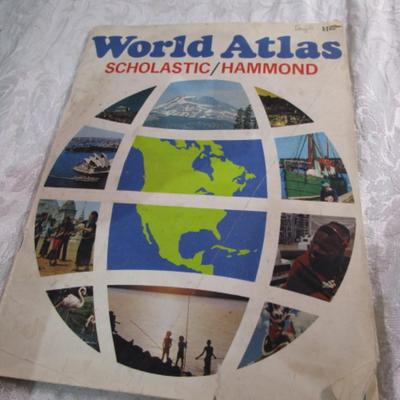 3 travel books, 1 travel magazine, 1 folder, 1 atlas