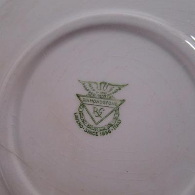 4 Vintage white saucers