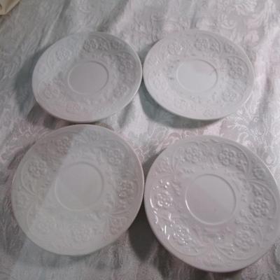 4 Vintage white saucers