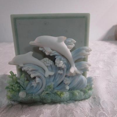 Vintage ceramic 4 coaster set with dolphins on waves holder