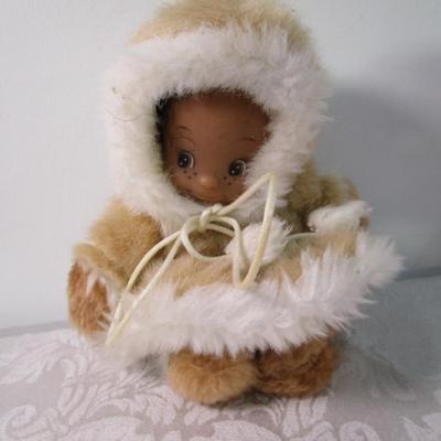 Porcelain clown, stuffed animals, hearts & swan, Eskimo doll