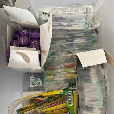 Tote with toothbrushes, pics and floss