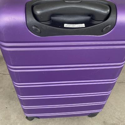 Purple suitcase and new Tachikara bag