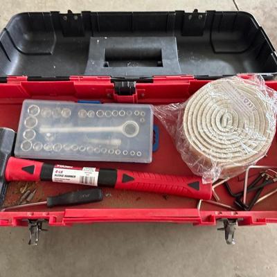 Black and red craftsman toolbox with tools inside