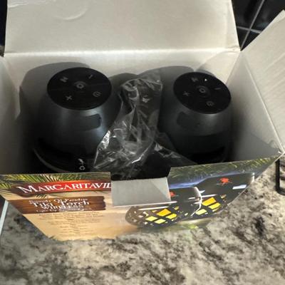 Ring spotlight cameras and 2 Wireless tiki torch speakers that light up.
