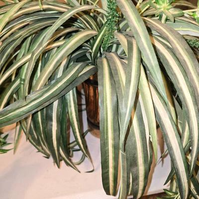 Faux spider plant in brass vase