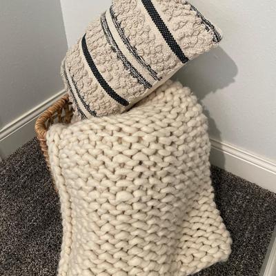 Basket with blanket and pillow decor