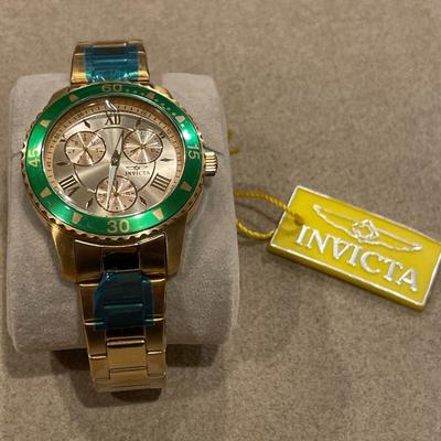 Sale Photo Thumbnail #776: Still has blue wrap on band
Green accents