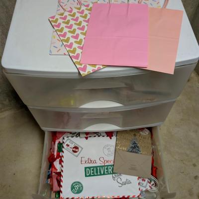 LOT 13B: 3 Drawer Plastic Storage Container On Wheels Containing Ribbons, Bows, Holiday Tags, Gift Bags & More Along With A Plastic...