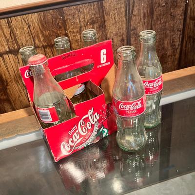 Lot 9 Vintage Broncos Coke Bottles in case