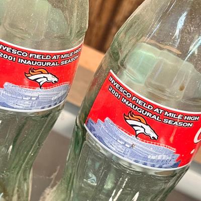 Lot 9 Vintage Broncos Coke Bottles in case