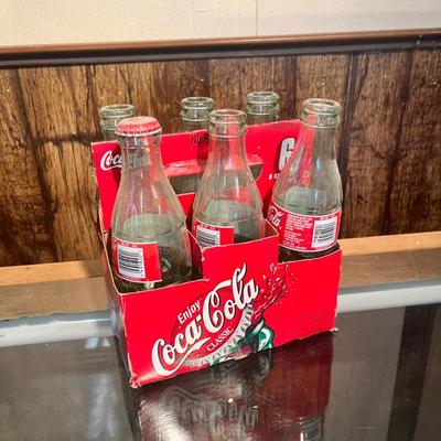 Lot 9 Vintage Broncos Coke Bottles in case