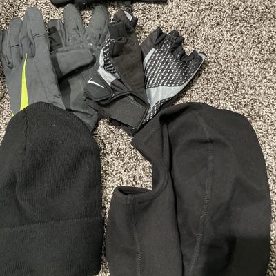 Small basket of gloves and hats with umbrella